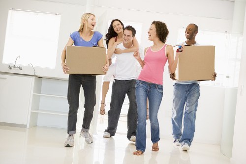 Moving van and packed boxes for a local Barnes house removal