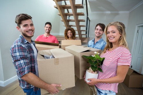 Removal team planning a move in Barnes with boxes and furniture