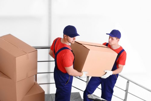 Removal van and moving team in Barnes residential street