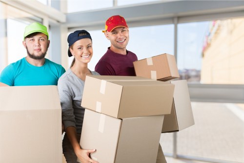 Professional movers handling boxes and furniture in Barnes