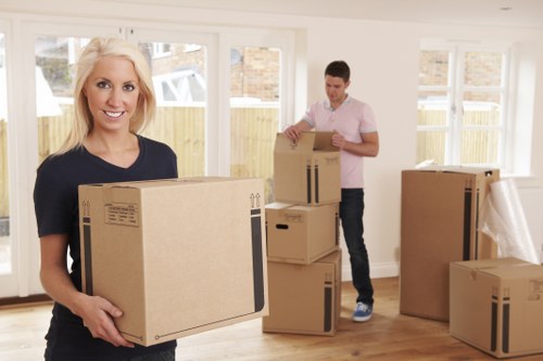 Removal team loading household items into a moving van