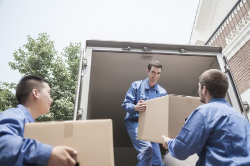 Boxes and furniture being loaded by movers in Barnes