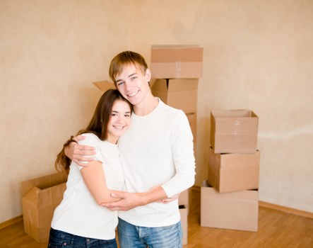 Professional movers packing and protecting household items for a Barnes move
