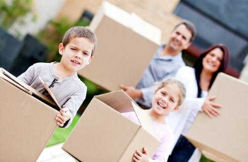 Relocation specialists organising desks and boxes in a Barnes office