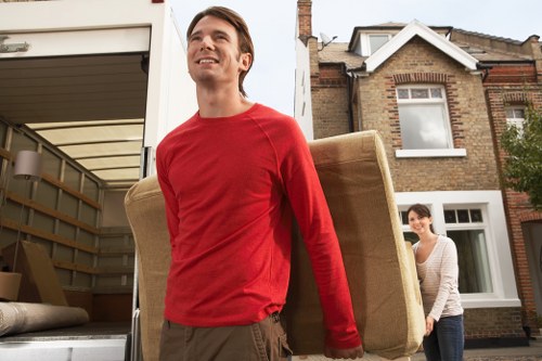 Local Barnes moving van navigating a quiet London road