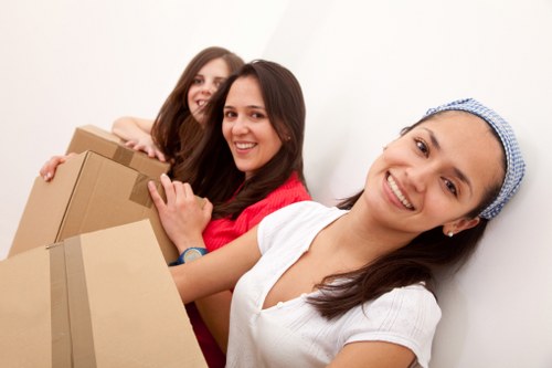 Organized packing materials and labeled boxes for relocation in Barnes