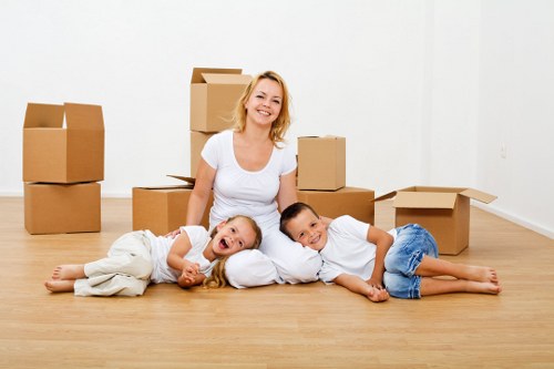 Professional movers in Barnes carrying boxes during a safe relocation