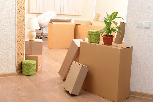 Wrapped sofa and wardrobe prepared for furniture removals in Barnes