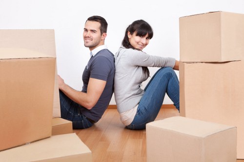 Office removal setup with labelled boxes and furniture