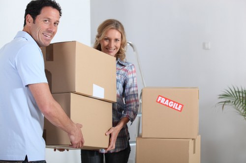 Removal professionals handling items carefully during transport